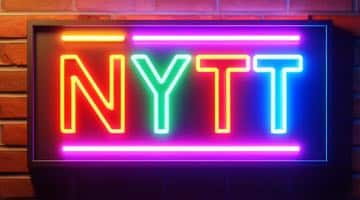 En neonskylt där det står "Nytt". Bilden symboliserar att Gaming Corps skapat ett nytt spel med Snoop Dogg
