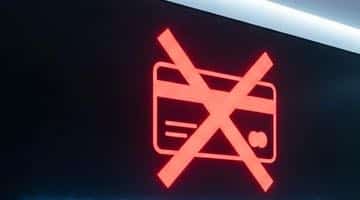 En skylt med ett överkryssat kreditkort. Bilden ska illustrera att ett kreditförbud på spel kommer införas.